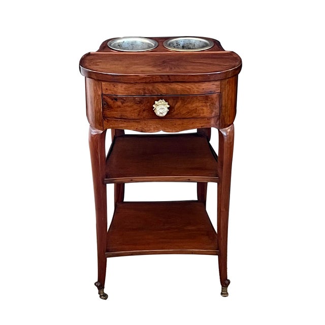 A superb Transition-style mahogany wine cooler reminiscent of Joseph Gegenbach Canabas (France 1715-1797); the curved...