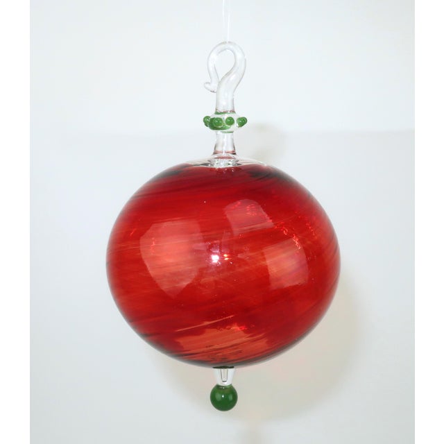 Deck the hall with artist made ornaments from the Seattle, Washington art glass gallery, Glass Eye Studio. This set of...
