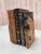 An elegant and organic pair of burl bookends with wonderful wood graining and natural edges. Brass stands securely...