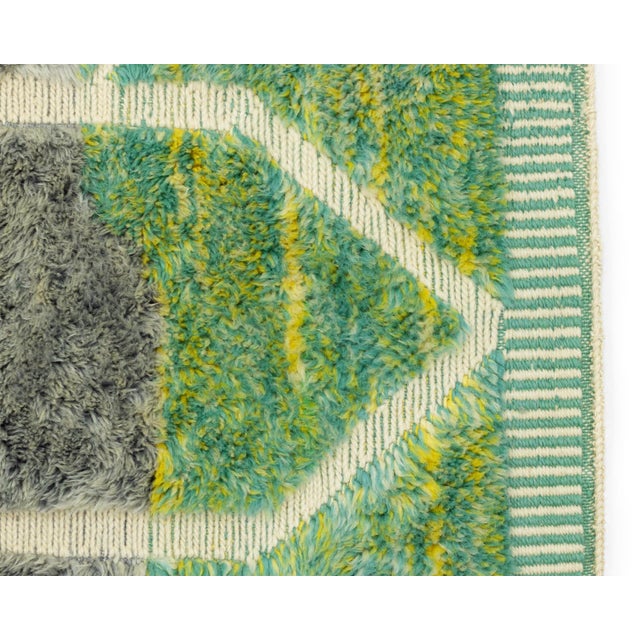 Abstract hand-knotted rug with a blend of Chartreuse, Sage Green, Emerald Green, and Slate Gray shades, featuring...