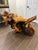 One-of-a-kind sculptural furniture piece crafted from a massive natural tree root, featuring dramatic organic form, rich...