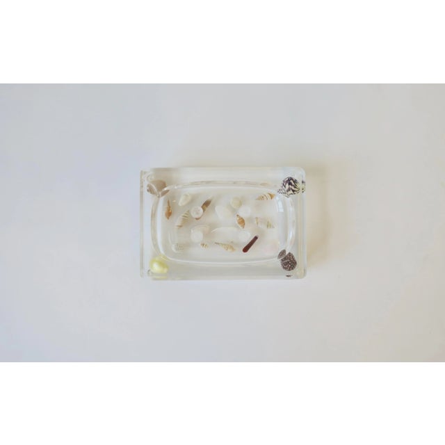 A great vintage acrylic and real natural seashells soap dish, circa Late-20th century, 1970s; fits a standard size bar of...