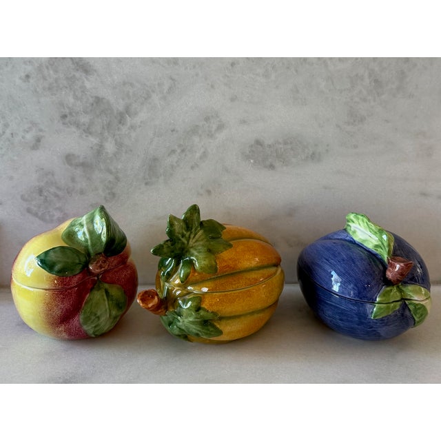 Set of 3 vintage hand painted Italian majolica art lidded dishes in the shape of different fruit. This set includes a...