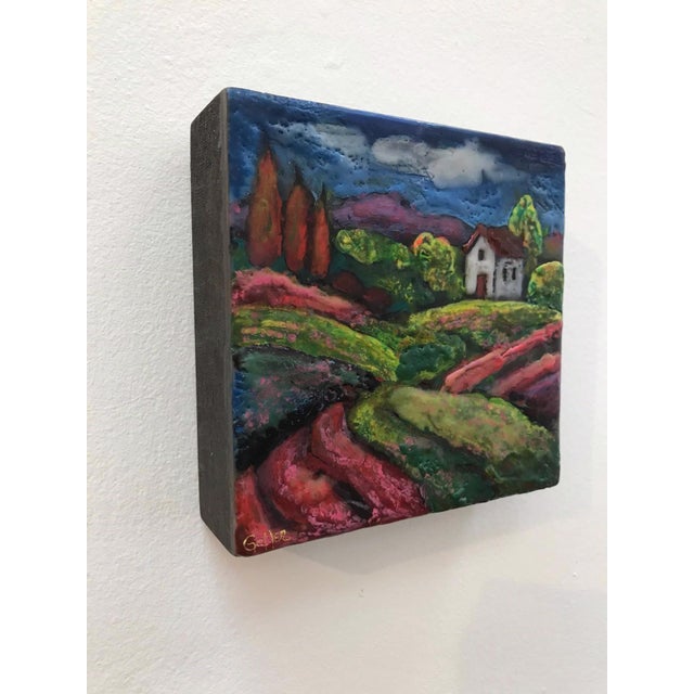Abstract Idyllic 63 by Carrie Goller | Encaustic on wood block Landscape with a house and colorful hills. For Sale - Image 3 of 3