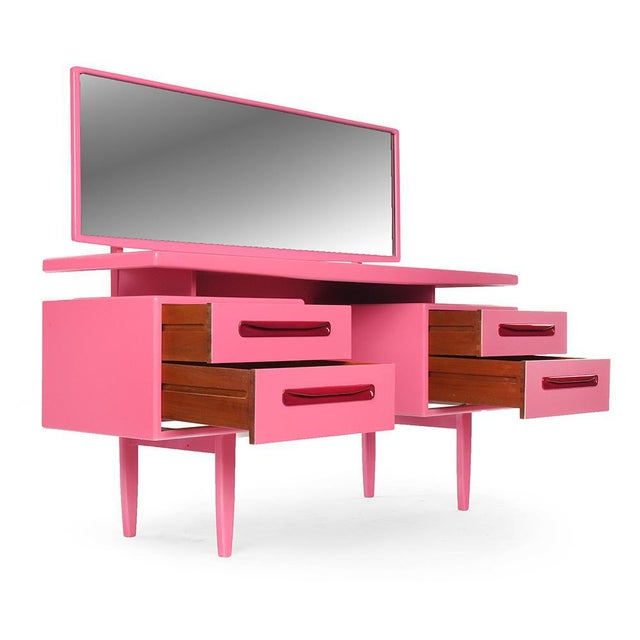 Pink lacquered wooden dressing table with 4 drawers and 1 large mirror. Vintage pink lacquered cabinet. It has 1 large...