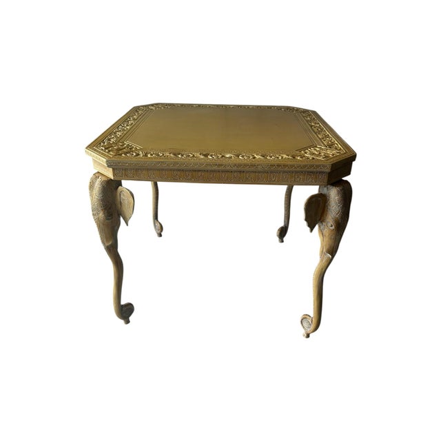 This Carved Elephant Heads and Trunks Game Side Table is an antique piece with original craftsmanship, featuring intricate...