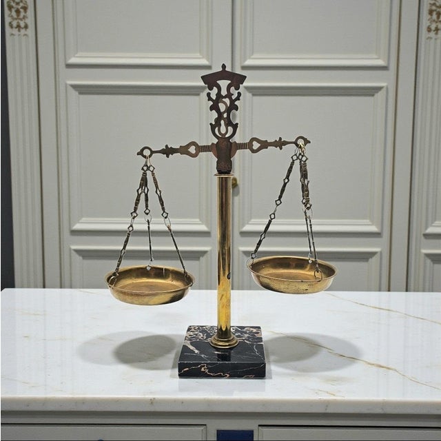 This vintage Scales of Justice sculpture presents the enduring legal symbol in a classic brass and marble composition....