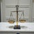 This vintage Scales of Justice sculpture presents the enduring legal symbol in a classic brass and marble composition....