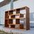 Vintage Scandinavian teak modular shelving system consisting of four individual interlocking pieces. Each piece features...