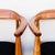 A rare set of four low-back elmwood dining or accent chairs by Illum Wikkelsø, produced in Denmark by Niels Eilersen c....