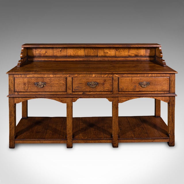 This is a large vintage Suffolk dresser base. An English, country house oak sideboard or kitchen server in Victorian...