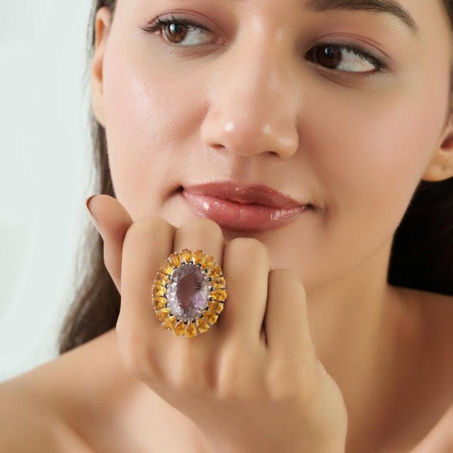 Crafted in 925 sterling silver, this bold cocktail ring features 25.62 carats of natural amethyst, citrine, and sapphire...