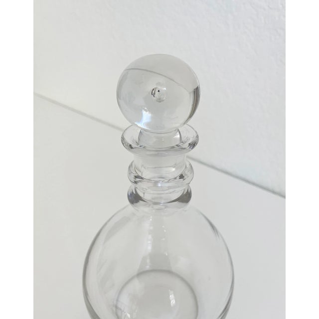 Vintage early 20th Century clear crystal glass decanter attributed to Donald Pollard Steuben. Details include a two ring...