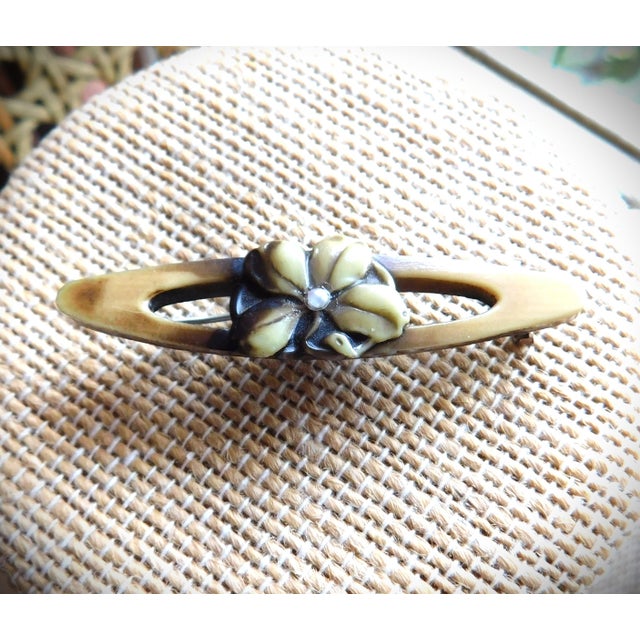 Beautiful Tan and Brown Art Deco Bakelite (earliest plastic) center floral bar pin, brooch pin with seed pearl. The...