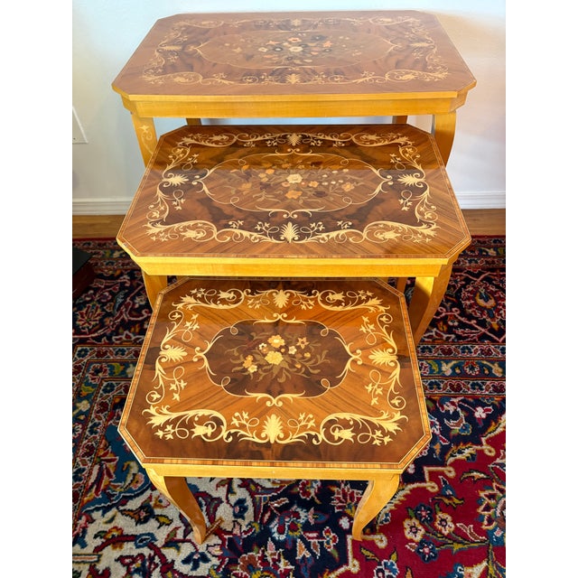 These nesting tables have the precious wooden inlaid design in all three tables. I can honestly use the words pristine in...