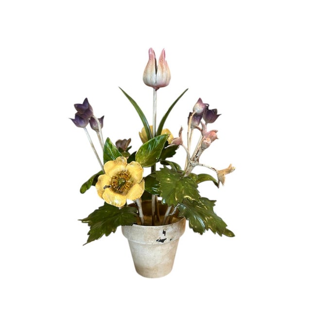 A charming, vintage tole floral arrangement. Features gorgeous, colorfully hued blooms accented by green leaves and stems...