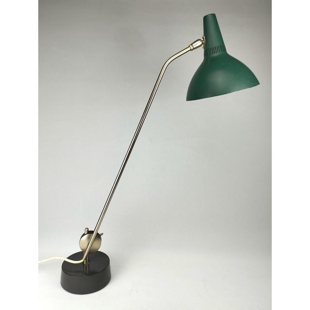 This very rare desk lamp from Kaiser Leuchten is also known as an architect's lamp because its extra-long arm can...