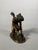 Patinated bronze sculpture by Antoine Chaudet (1763-1810), depicting Cupid playing with a butterfly. Bronze with a golden-...