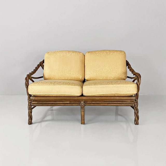 American modern rattan and beige floreal fabric sofa by McGuire Company, 1970s. Two-seater sofa with seat and back made by...