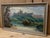 A captivating vintage English landscape watercolor, depicting the romantic ruins of a castle or abbey nestled within a...