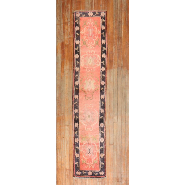 An early 20th century narrow Tibetan Runner in orange. Measures: 1'7'' x 7'6''.
