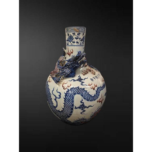 20th century, bearing an apocryphal Xuande six-character mark An imposing celestial-globe vase (tianqiuping) of grand...