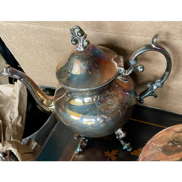 Here is an elegant rich looking 6 piece silver plate tea service including; kettle on stand which still has the burner,...