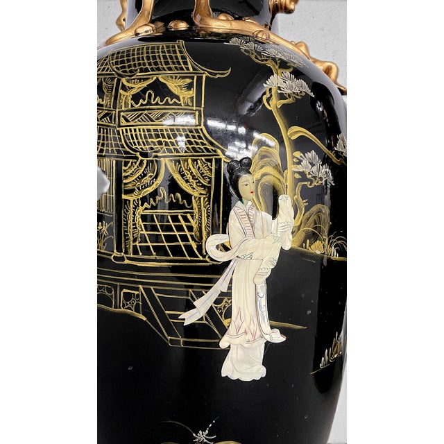 An exceptional pair of monumental chinoiserie floor vases, each standing 36 inches tall and measuring an impressive 17...