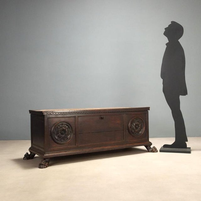 Late 19th century walnut chest crafted in neo-baroque style, featuring a dentilated frame beneath the top that adds a...