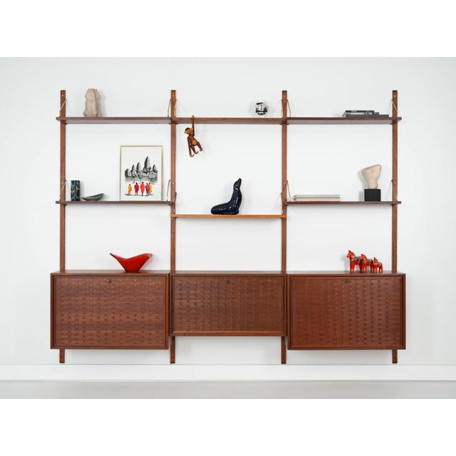 This modular shelving unit was made in the 1960s and designed by renowned Danish designer Poul Cadovius. The structure is...