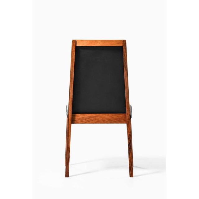 Rare set of eight dining chairs produced by dyrlund in denmark. These chairs are crafted from luxurious rosewood,...