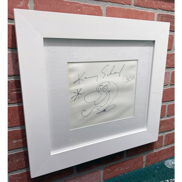 Original marker drawing on paper. Hand signed and dated on front by Kenny Scharf. Visible artwork size in the frame 8 x...