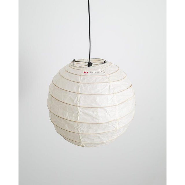 A rare and iconic mid century "30d" round ceiling pendant lamp in washi paper and bamboo by isamu noguchi produced and...