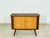 Very beautiful mid-century modern chest of drawers from the 1960s. The piece impresses with its clean lines, elegant wood...