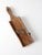 This vintage handheld slicer features a primitive design with a wooden frame and metal blades. A hole in the handle makes...