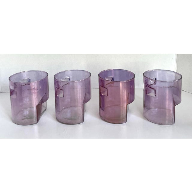 This striking set of four postmodern amethyst glass tumblers features a wonderfully sculptural design that feels equal...