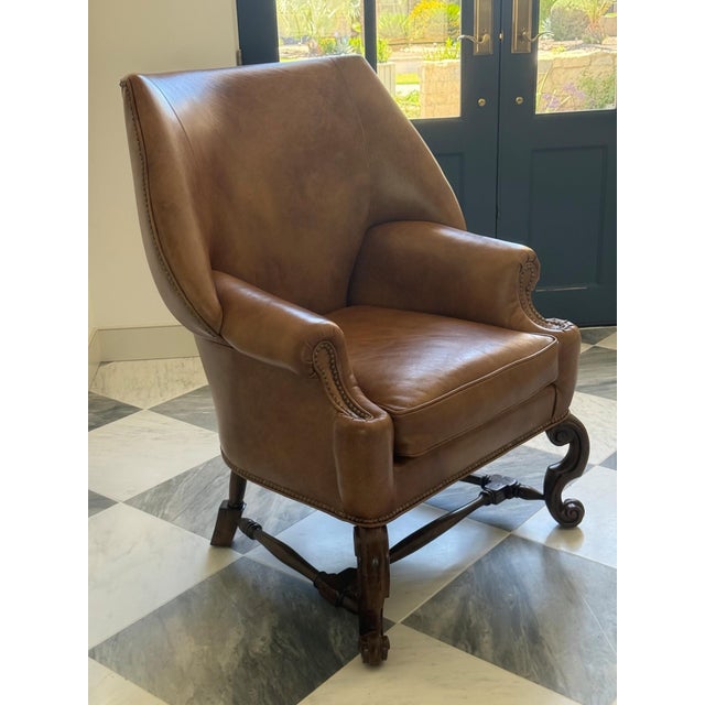 Stunning pair of Ferguson Copeland, Ltd. leather armchairs featuring rich cognac leather, classic nail head trim, and...