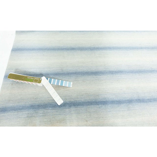Contemporary striped blue hand knotted wool rug by Doris Leslie Blau. Size: 6'0" × 9'10" (182 × 299 cm). A modern hand-...