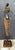This vintage African-inspired handcrafted metal sculpture depicts a graceful female figure carrying a traditional vessel,...