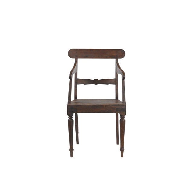 This Vintage Anglo-Indian Teakwood Armchair is handcrafted from solid teakwood, featuring gracefully curved arms, a shaped...