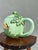 This vibrant vintage ceramic pot, originating from Guaitil, Costa Rica, showcases the traditional Chorotega pottery style....