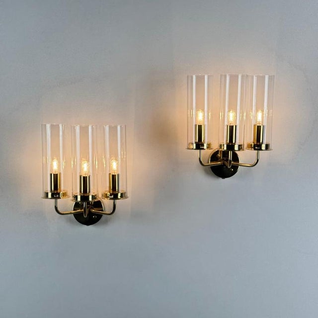 A poetic pair of wall lamps from the celebrated “sonata” series by hans-agne jakobsson, produced in markaryd during the...