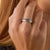 This contemporary eternity band by Lugano showcases a continuous row of 27 baguette cut sapphires totaling approximately...