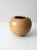 A signed vintage handmade studio pottery vase featuring a beautifully rounded form and organic modern presence. The warm...