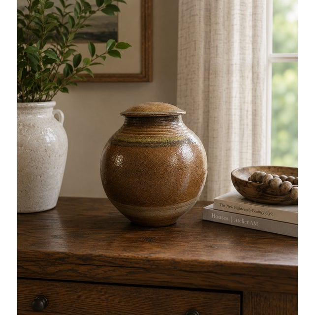 This gorgeous studio pottery stoneware salt-glaze covered moon jar by S. Bernhardt is a masterful blend of artistry and...