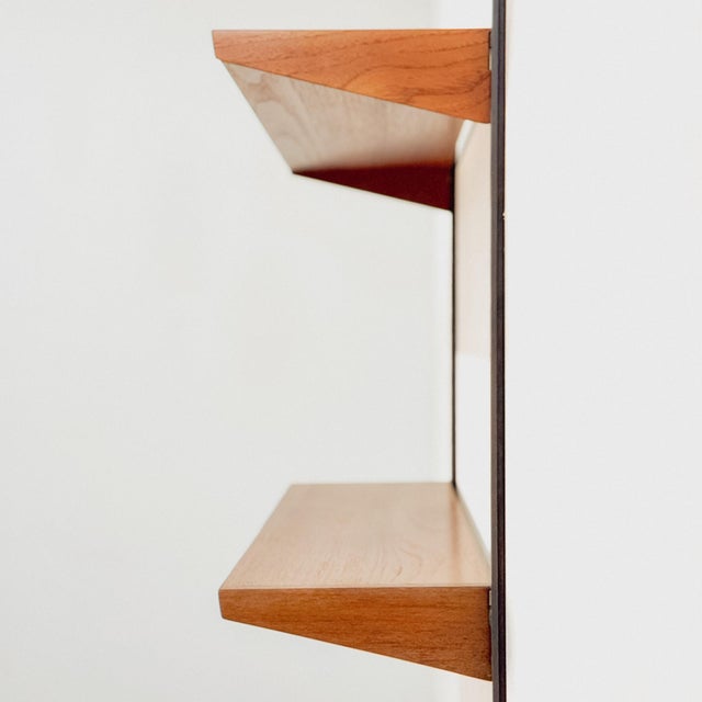 Set of two teak shelves designed by Kai Kristiansen and produced by FM Møbler in Denmark in the 1960s. This iconic mid-...