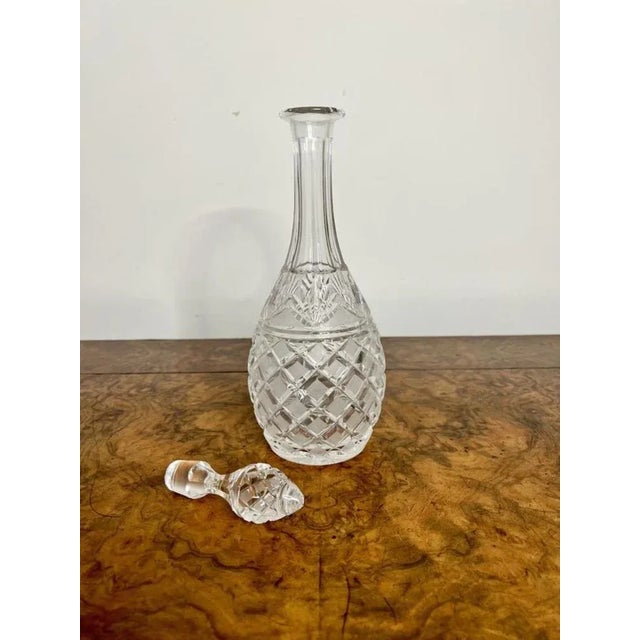 Quality antique cut glass decanter. Having a pear shaped quality cut glass decanter with the original cut glass stopper....