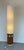 Tall and warm Mid-Century floor lamp in two parts. A teak cylindrical base supports a beautiful lampshade in textured...