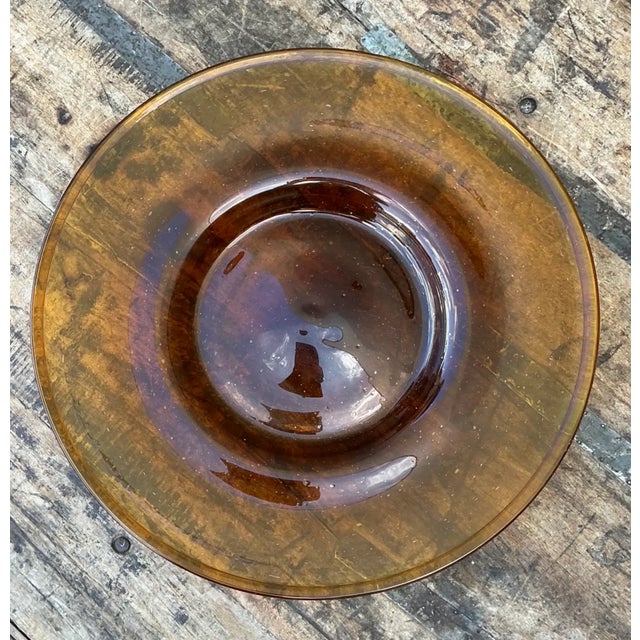 With its warm amber hue and softly translucent surface, this vintage glass serving tray brings mid-century character to a...