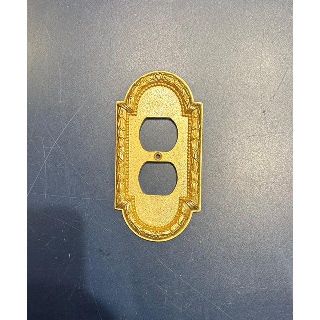 Set of 27 Sherle Wagner Acanthus Double Switch Plates. Burnished Gold Finish.